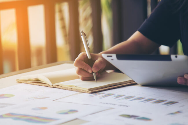 Business women signature at document Booking AAT assessments